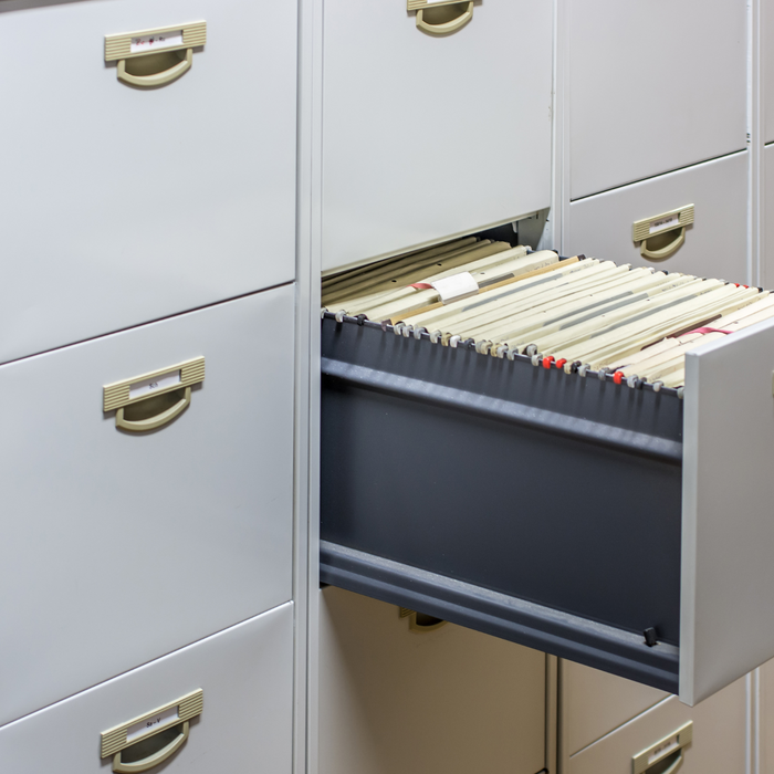 What is the difference between fireproof and fire-resistant file cabinets?